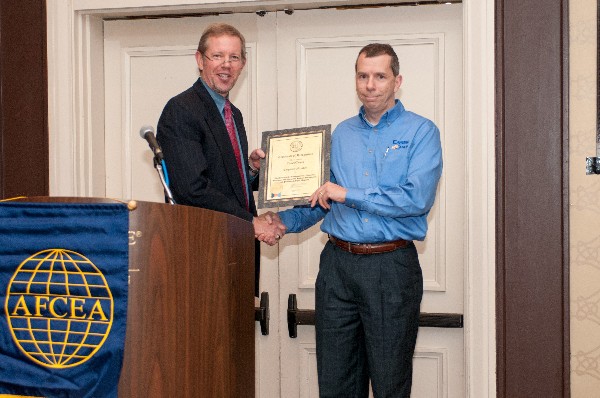 In November, Hardiman (l) presents a Corporate Membership Certificate to Bob Haas, representing Cases Cases as a new corporate member.